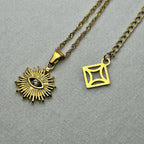 gold necklace with sunburst pendant featuring diamond center on textured fabric background