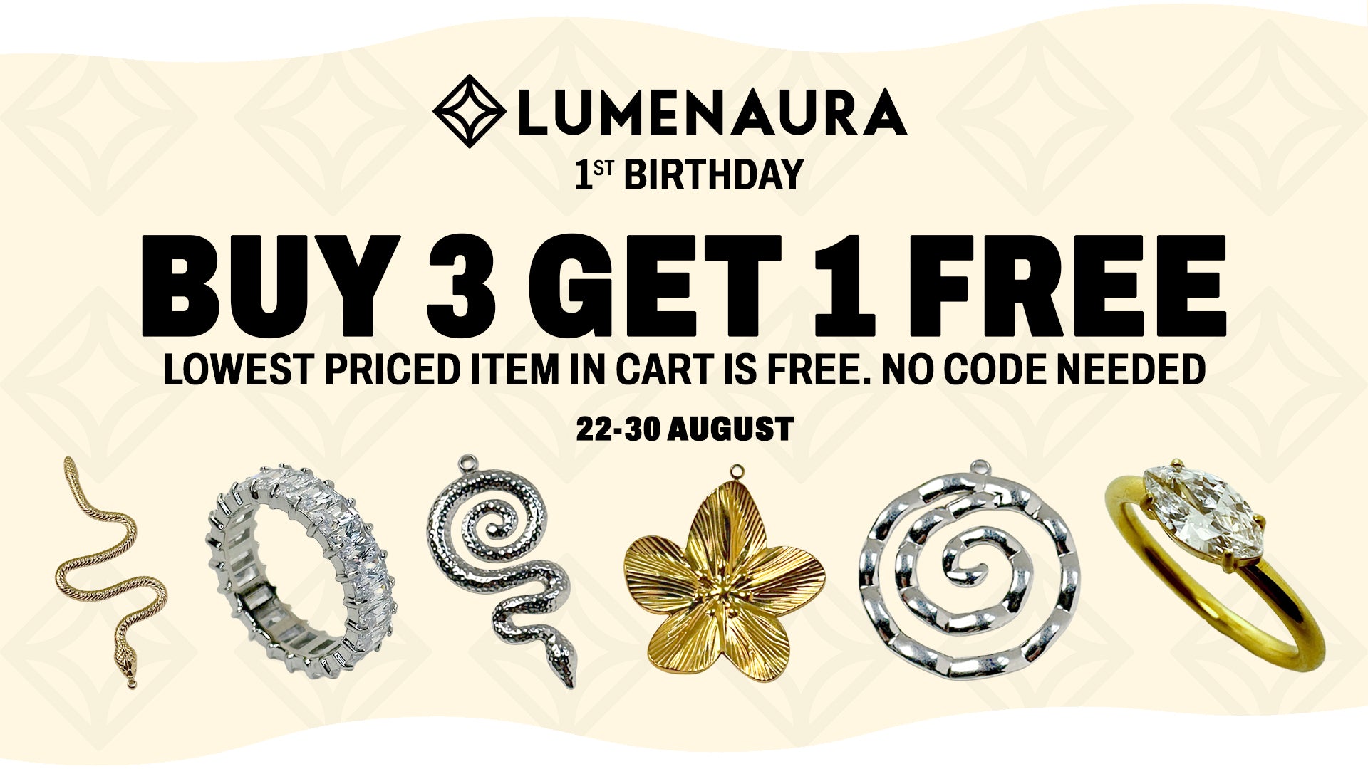 Promotional banner for LUMENAURA 1st Birthday offering a buy 3 get 1 free deal. The image features five jewelry items at the bottom: a gold snake pendant, a silver textured ring, a silver spiral pendant, a gold flower pendant, and a gold and silver spiral ring.