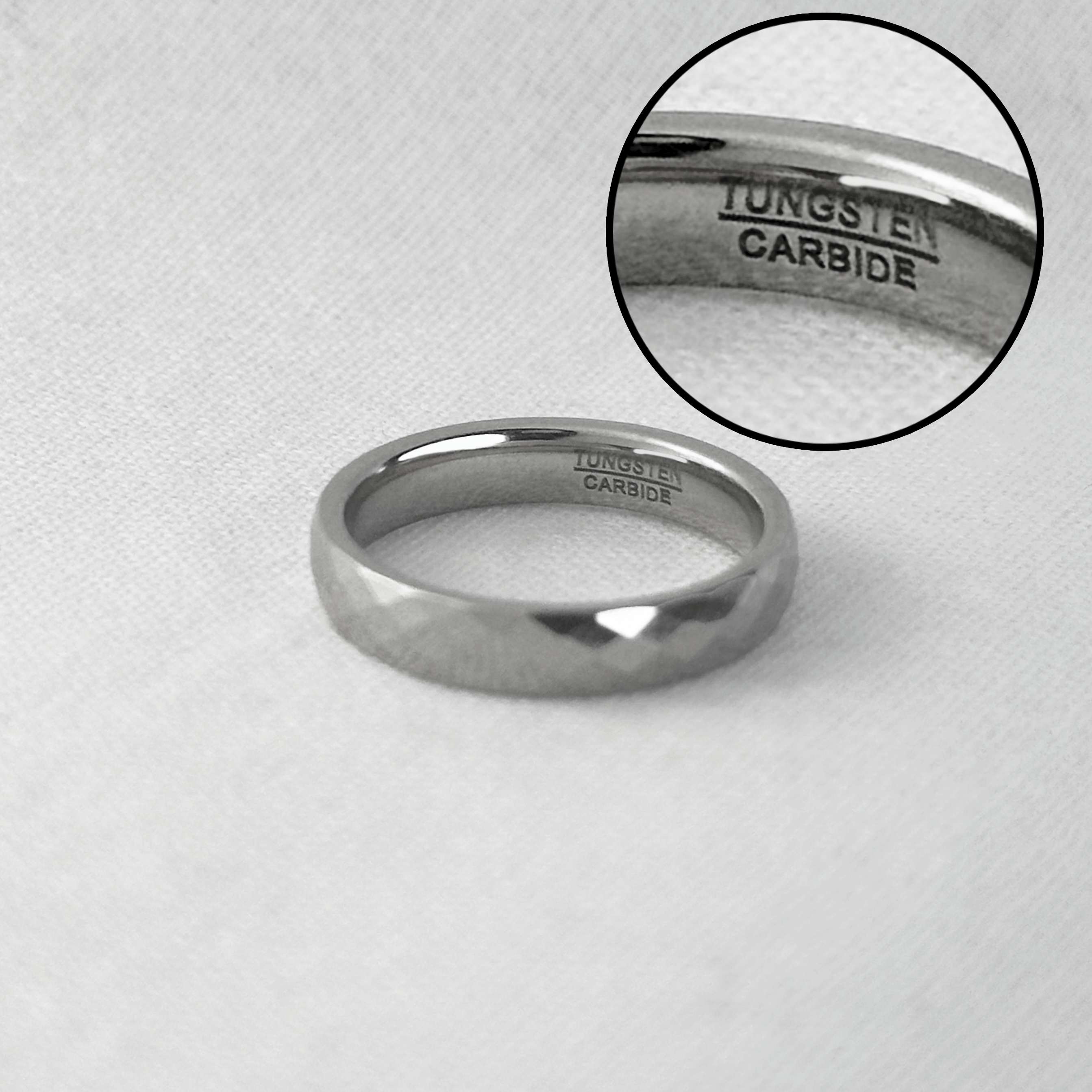 Tungsten carbide ring with 'TUNGSTEN CARBIDE' engraving on a white background